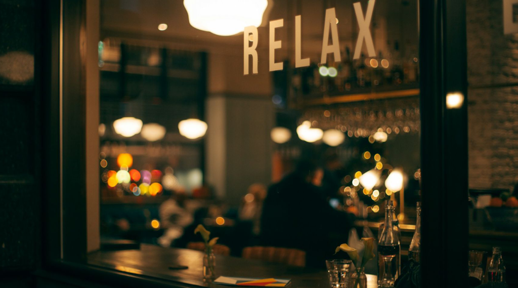 The interior of Lula’s reflects the rustic elegance of Tuscany, with warm tones, textured finishes, and artistic accents